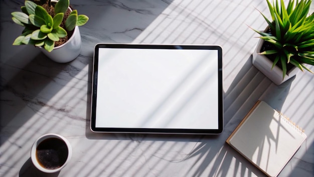 Free Photo blank tablet screen mockup on marble table