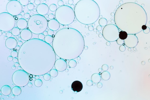 Free photo blue abstract bubbles with black dots