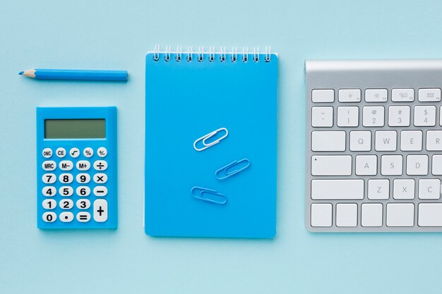 Blue notepad and keyboard top view