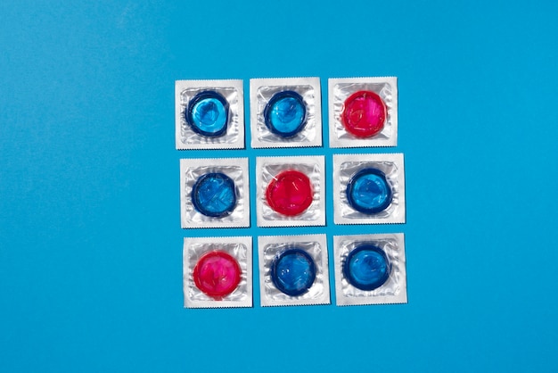 Free photo blue and red condoms arrangement top view