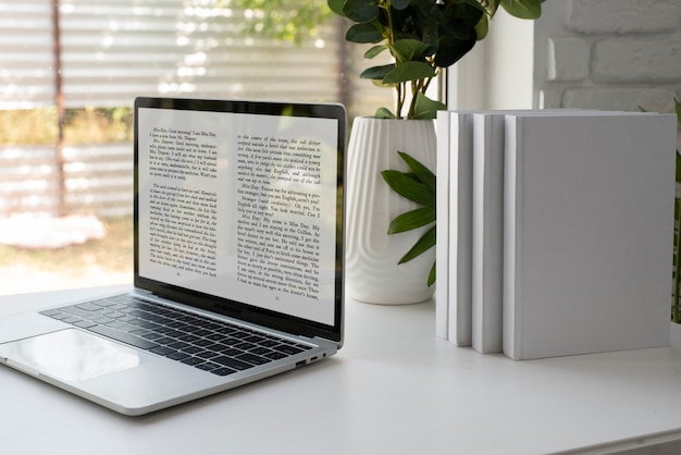 Books and laptop assortment