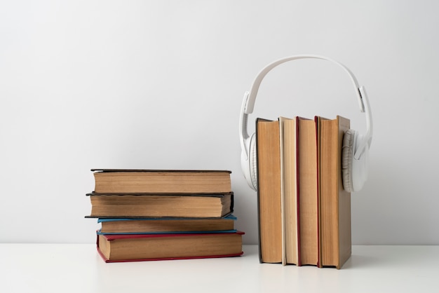 Books stack with headphones  arrangement