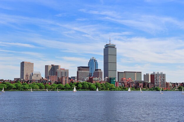 Boston city skyline with Prudential Tower and urban skyscrapers over Charles River.