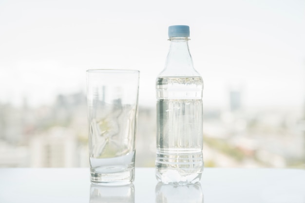 Free photo bottle of water with glass