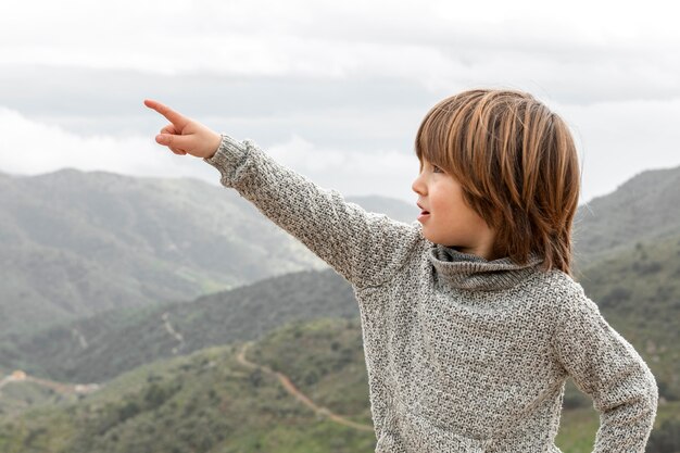 Boy pointing out