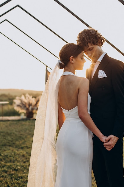 Free photo bride and groom on their wedding ceremony