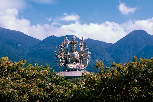 Free Photo buddha statue in natural environment