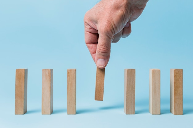 Free photo businessman using wooden pieces