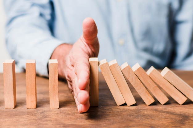 Free photo businessman using wooden pieces