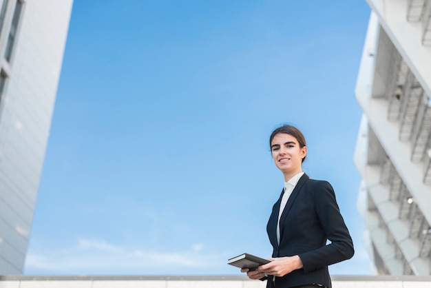 Free photo businesswoman on sky background