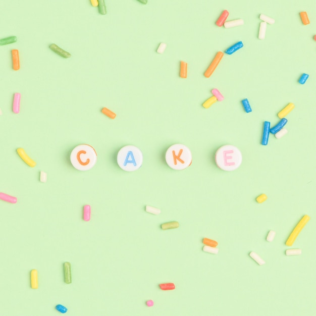 Free photo cake beads text typography on green