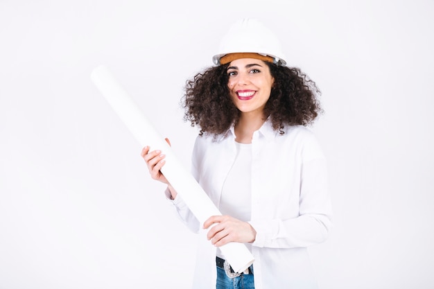 Free photo cheerful young woman with blueprints