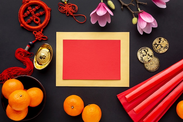 Free photo chinese new year card mock-up with tangerines and magnolia