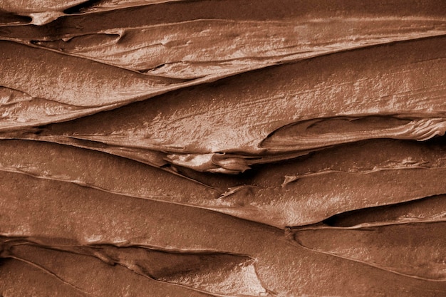 Free photo chocolate frosting texture background close-up