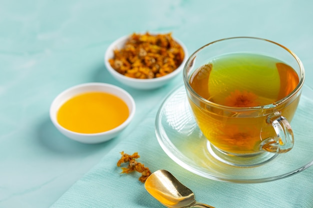 Free Photo chrysanthemum flower tea on table