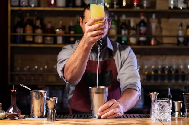 Free photo close up on bartender and cocktail shaker