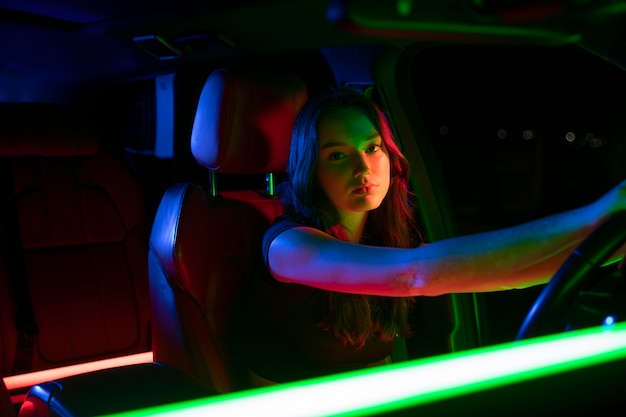 Close up on beautiful young woman driving