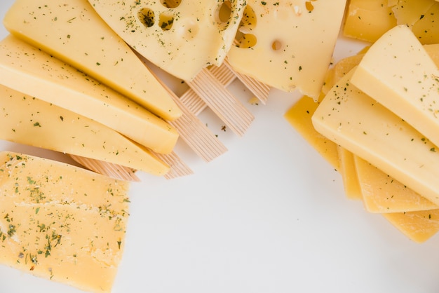 Free photo close-up of cheese wedges on white background