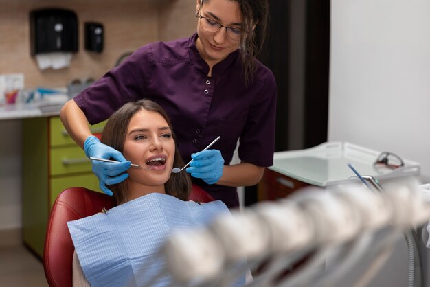 Close up on dentist using instruments