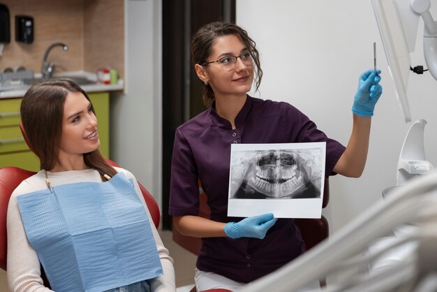 Close up on dentist using instruments