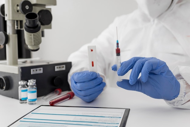 Free photo close-up of a doctor holding a blood sample