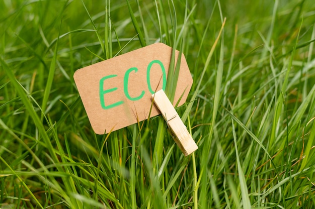 Free photo close-up eco sign in grass