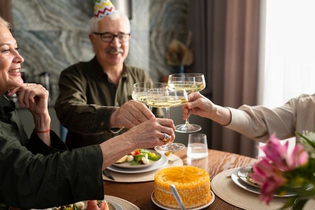 Free Photo close up family clinking glasses