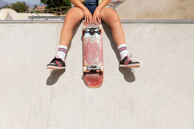 Close up hands holding skateboard