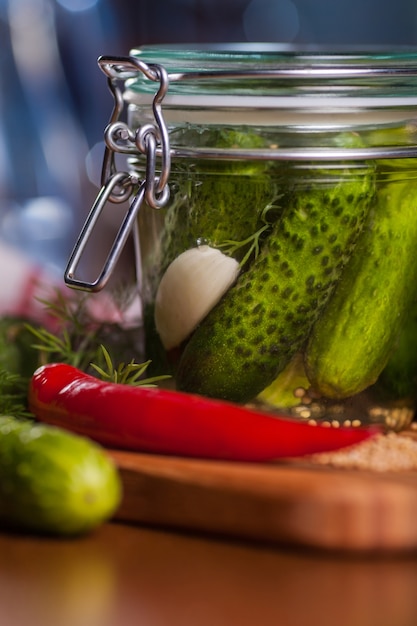 Free Photo close up of jar with pickled cucumbers
