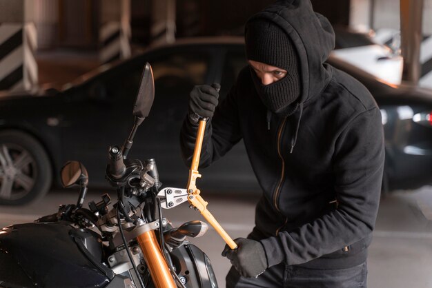 Close up on man preparing to steal a motorcycle