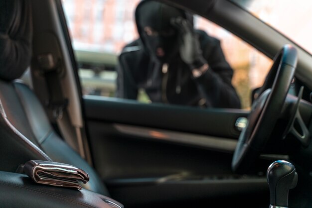 Close up on man trying to break into a car