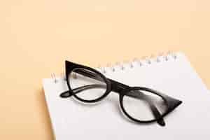 Free photo close-up optical eyeglasses on a notebook