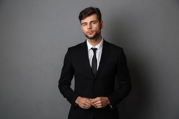 Free photo close-up photo of young successful business man in black suit