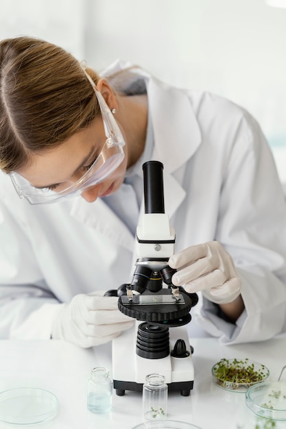 Free photo close up scientist with microscope