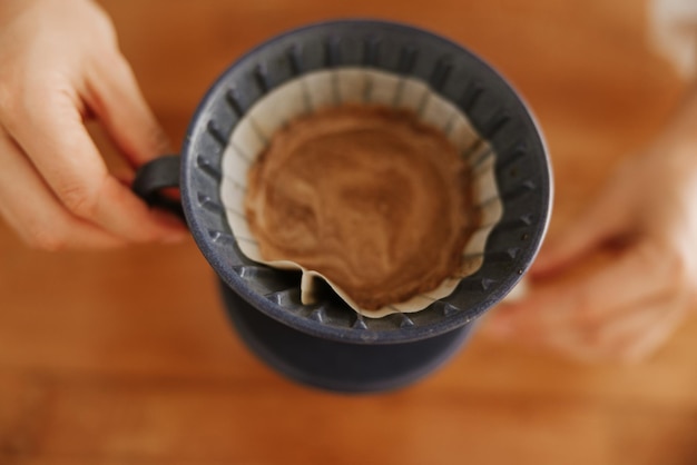 Free photo close up view of drip coffee on desk table