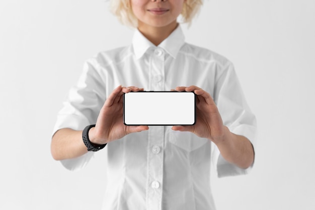 Close up woman holding smartphone