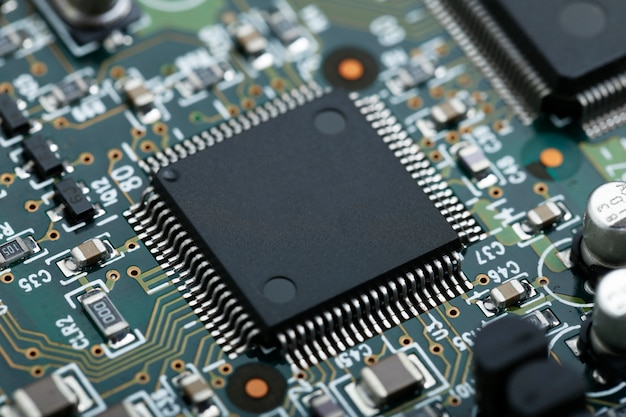 Free photo closeup of electronic circuit board with cpu microchip electronic components background