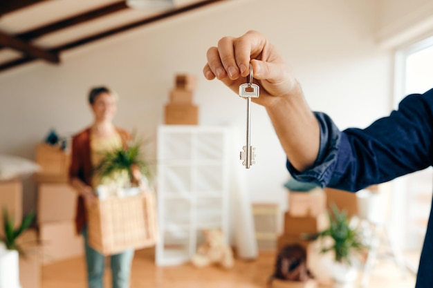 Free Photo closeup of man holding key of his new home