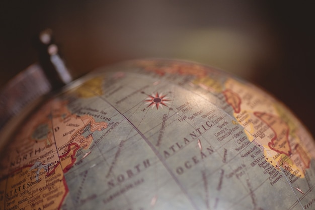 Free photo closeup shot of a desk globe with a blurred background