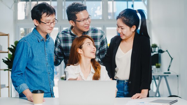 Collaborative process of multicultural businesspeople using laptop presentation and communication meeting brainstorming ideas about new project colleagues working plan success strategy in home office.