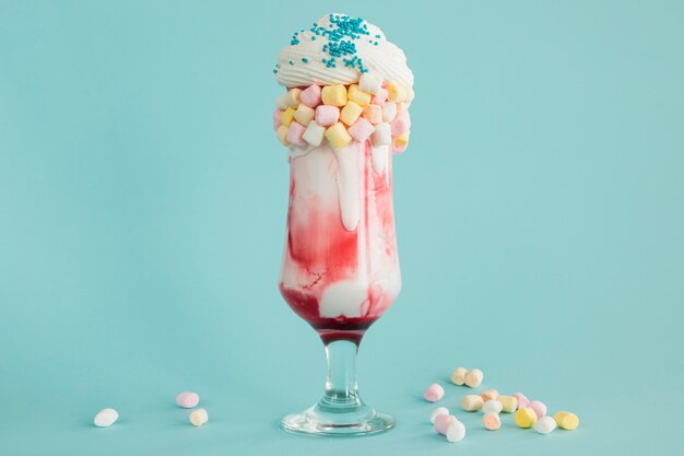 Colorful milkshake with blue background