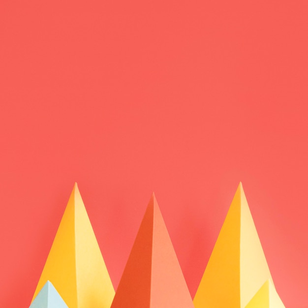 Free Photo colorful triangle paper pack with copy-space