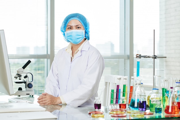 Free photo confident asian microbiologist posing for photography