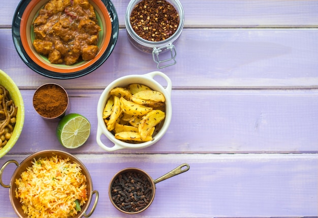 Free photo containers with spices near lime and dishes