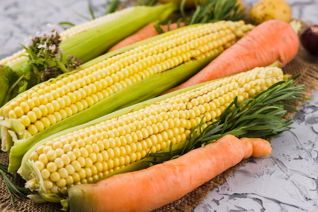 Free photo corn and carrot harvest closeup