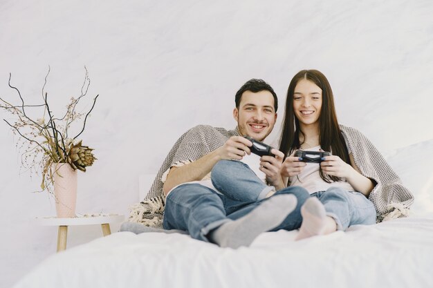 Couple at home playing video games