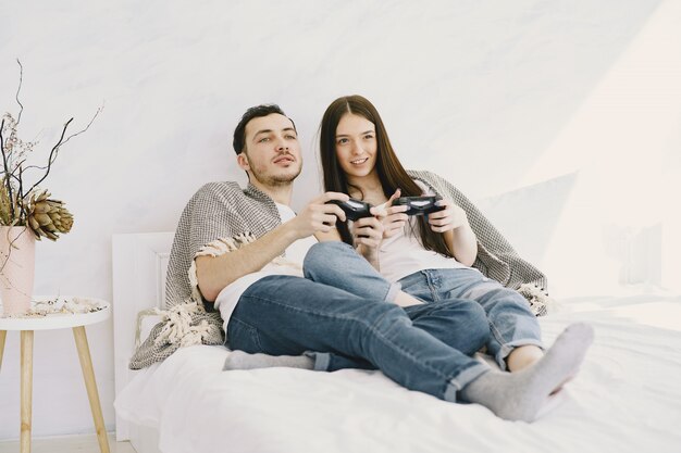 Couple at home playing video games