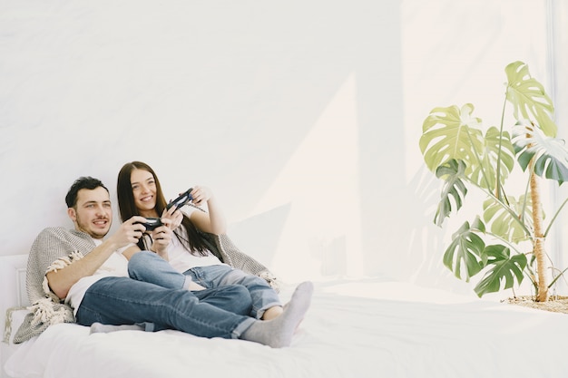 Couple at home playing video games