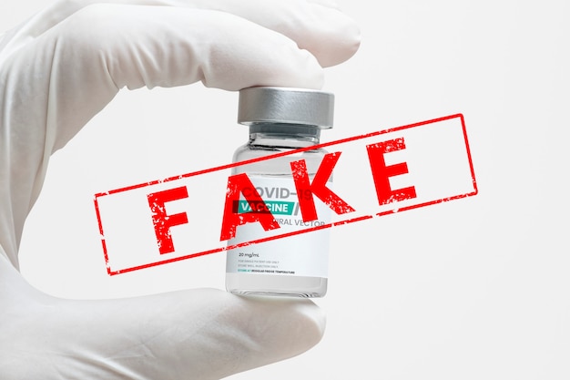 Free photo covid-19 vaccine with ‘fake’ stamp