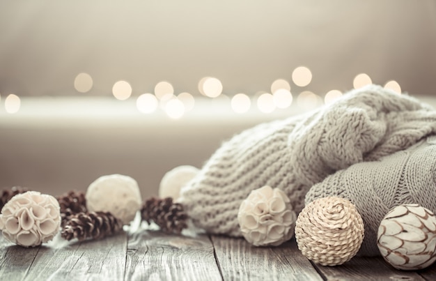 Cozy Christmas background on a wooden background with objects of Christmas decor .